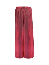 Conjunto de blazer y pantalón de la marca Las Raras, confeccionado con telas sublimadas basadas en obras de arte de Inés Garibaldi. El blazer es de talle L/XL y el pantalón es de talle L/XL con cintura elástica.