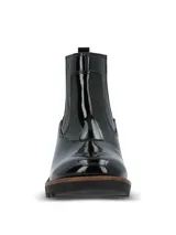 Botas Chelsea Hush Puppies de caña corta, confeccionadas en material sintético con acabado charol brillante. Presentan elásticos laterales para un calce sencillo, suela robusta de goma con plataforma y taco ancho.