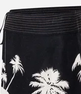 Pollera corta de playa confeccionada en viscolino con viscosa certificada. Diseño cruzado con cintura ancha y estampado de palmeras.