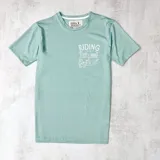 Remera verde agua de algodón con cuello redondo y estampado blanco con la frase "Riding Is A State Of Mind".