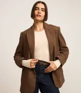 Blusa de algodón color negro, de corte ajustado, con cuello redondo y mangas largas.