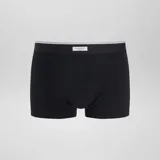 Pack de tres bóxers de algodón elástico con cinturilla elástica con logo. Incluye un bóxer negro con estampado geométrico en gris, un bóxer negro liso y un bóxer negro con estampado de lunares blancos.