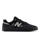 Championes de skate New Balance Numeric 306, color negro con detalles en gris y beige.