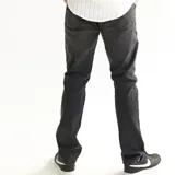 Pantalón jean skinny negro con efecto localizado.