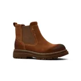 Bota tipo Chelsea de cuero gamuzado color marrón, con paneles laterales elásticos, costuras reforzadas y suela de goma dentada con plataforma.