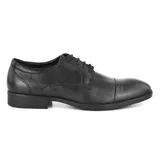 Zapato de vestir de cuero negro con cordones, punta redondeada y suela de goma. Marca Hanker.