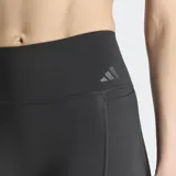Calzas largas Adidas Optime Workout Contour de color negro, diseñadas para entrenamiento con ajuste ceñido, tiro súper alto y bolsillos en los muslos.