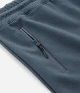 Pantalón jogger deportivo de hombre en color azul, con cintura elástica ajustable con cordón, bolsillos laterales con cierre de cremallera y bajo ajustado con puño elastizado.
