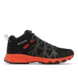 Bota de senderismo Columbia Peakfreak II Mid Outdry, color negro con entresuela naranja moteada. Presenta un diseño de altura media con malla técnica, sistema de ajuste Navic Fit, membrana impermeable OutDry y suela Adapt Trax para tracción en diversos terrenos.