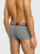 Bóxer gris melange para hombre, con cintura elástica negra que lleva el logo de Diesel en blanco y rojo.