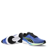 Championes deportivos Puma modelo Redeem Profoam, con parte superior de malla transpirable en color azul, detalles en negro y acentos en amarillo neón. Incorporan tecnología Profoam para una amortiguación superior y suela de goma para mayor tracción.