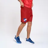 Bermuda deportiva azul marino con escudo del Club Nacional de Football y logo de Umbro.