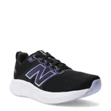 Championes de running New Balance modelo 460 para mujer, color negro con malla transpirable. Presentan el logo 'N' lateral en color violeta con borde iridiscente y entresuela blanca gruesa.