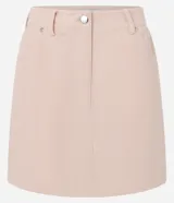 Minifalda color beige confeccionada en terciopelo cotelé, de cintura alta y corte recto.