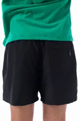 Short de baño negro con logo estilo vintage de la marca Vernal Club en colores neón.