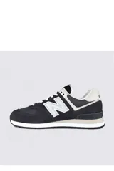 Championes deportivos New Balance modelo 574, color verde con detalles en gris y blanco, confeccionados en gamuza y malla, con el logotipo "N" característico en los laterales y entresuela ENCAP.