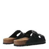 Sandalias tipo Birkenstock marca Freeway, color negro, con doble tira ajustable mediante hebillas metálicas y plantilla anatómica de corcho.
