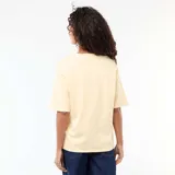 Camiseta de corte oversize y cuello redondo, con mangas cortas y diseño liso en color amarillo claro.