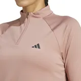 Buzo Adidas de training color rosa, con cierre corto y cuello alto. Confeccionado en poliéster reciclado y elastano, con tecnología Aeroready.