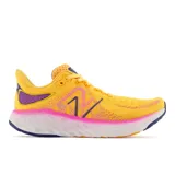 Championes de running New Balance Fresh Foam X 1080v12, color amarillo con detalles en rosa, violeta y azul.