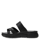 Sandalias de mujer con diseño de tiras cruzadas y ajuste mediante hebilla lateral. Presentan una suela de plataforma blanca con relieve y plantilla anatómica, ofreciendo un estilo casual y cómodo.