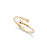 Pulsera rígida dorada con terminaciones redondeadas, de aleación de metales bañados en oro 18k con muelle interior.