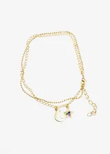 Pulsera dorada con doble cadena, una de eslabones y otra de bolitas. Incluye dije de luna lisa y dije de estrella con pequeñas circonitas de colores.