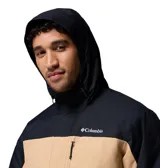 Campera impermeable Columbia modelo Hikebound II Insulated Omni-Heat, con diseño en bloques de color beige y negro, capucha ajustable y cierre frontal con cremallera y solapa.