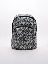 Mochila con estampado botánico en tonos azul marino y blanco, con dos compartimentos frontales con cierre y tiradores de cremallera trenzados.