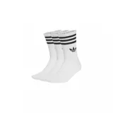 Pack de tres pares de medias de caña media Adidas, color blanco con tres rayas negras en el puño y logo del trébol bordado en negro.