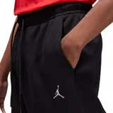 Pantalon de jogging Jordan modelo Brooklyn Fleece, color negro, con cintura elástica ajustable mediante cordón, puños acanalados en los tobillos y logo Jumpman bordado en contraste en la pierna izquierda.