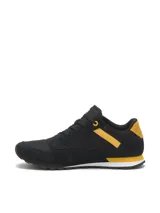 Championes Caterpillar modelo Ventura, de estilo casual y versátil en color negro con detalles en amarillo y blanco. Capellada de gamuza y malla de nylon, entresuela de EVA y suela de goma con tracción.