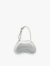 Minibolso charm Diesel Play con diseño inspirado en un control de videojuegos, confeccionado en material de acabado brillante color rojo. Presenta el icónico logo metálico Oval D en el frente y un gancho superior tipo llavero con correa.
