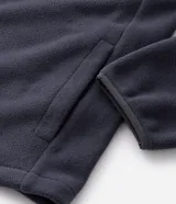 Buzo de fleece color verde agua con capucha ajustable, cierre frontal completo y bolsillo con cierre en el pecho. Presenta un diseño funcional con recortes en tejido plano y calce regular.