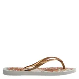 Sandalias tipo ojotas Havaianas modelo Slim Organic, con base negra y estampado floral en tonos rosados y dorados. Presentan tiras finas de color negro con textura grabada.