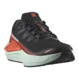 Championes de trail running Salomon DRX Defy Grvl, color negro con detalles en naranja y entresuela verde menta, diseñados con soporte y ligereza para correr en caminos de grava y asfalto.