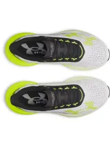 Championes de running Under Armour modelo Velociti Distance, con tecnología de amortiguación HOVR+ en la entresuela. Presentan un diseño técnico en color blanco con detalles en amarillo neón y negro, confeccionados en tejido de malla transpirable.