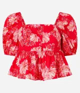 Blusa peplum cropped de tricolina con estampa floral, escote cuadrado, mangas abullonadas cortas y botones delanteros.