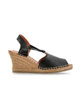 Sandalia de cuña Vilma color negro, con plataforma de yute, capellada de cuero y finas tiras elásticas de ajuste.