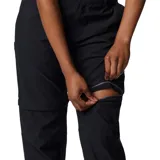 Pantalón largo negro convertible en short, de tiro medio con presillas para cinturón y bolsillos laterales, ideal para actividades al aire libre y trail.