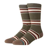 Medias Stance Hill Top Crew color verde oliva con rayas horizontales en marrón, blanco y rojo.