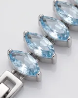 Pulsera de acero con diseño de eslabones engarzados con circonias en corte marquise de color azul claro.