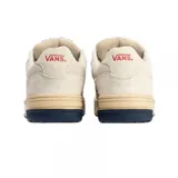Championes Vans modelo Upland VNTG, de diseño retro con capellada en color blanco hueso, detalle de logo lateral en azul y rojo, y suela de plataforma en tono crema con base azul oscuro.