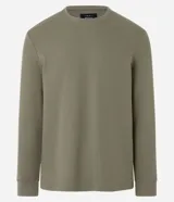 Remera de manga larga con cuello redondo y textura, de corte regular. Confeccionada en una mezcla de algodón, poliéster y viscosa.