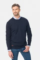 Buzo tejido de algodón y cashmere color azul marino, con cuello redondo y mangas largas.
