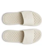 Chancletas Under Armour UA Ignite Pro 8 SL de color beige, con correa ajustable con acabado mate y forro de espuma suave. Cuenta con plantilla de espuma viscoelástica, laterales elevados para mayor estabilidad y suela de EVA con dibujo ranurado.