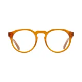 Lentes de receta con armazón de acetato en color miel, con diseño de frente redondeado y puente estilo cerradura.