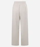 Pantalón wide leg de algodón y poliéster, color beige, con cintura elástica y detalle de costuras verticales frontales.