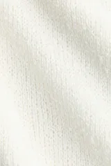 Pantalón de punto color blanco, de corte amplio y relajado, con cintura elástica y cordón ajustable.