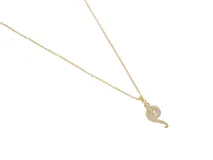 Collar de acero con baño de oro y dije de serpiente con circonias y ojos verdes.